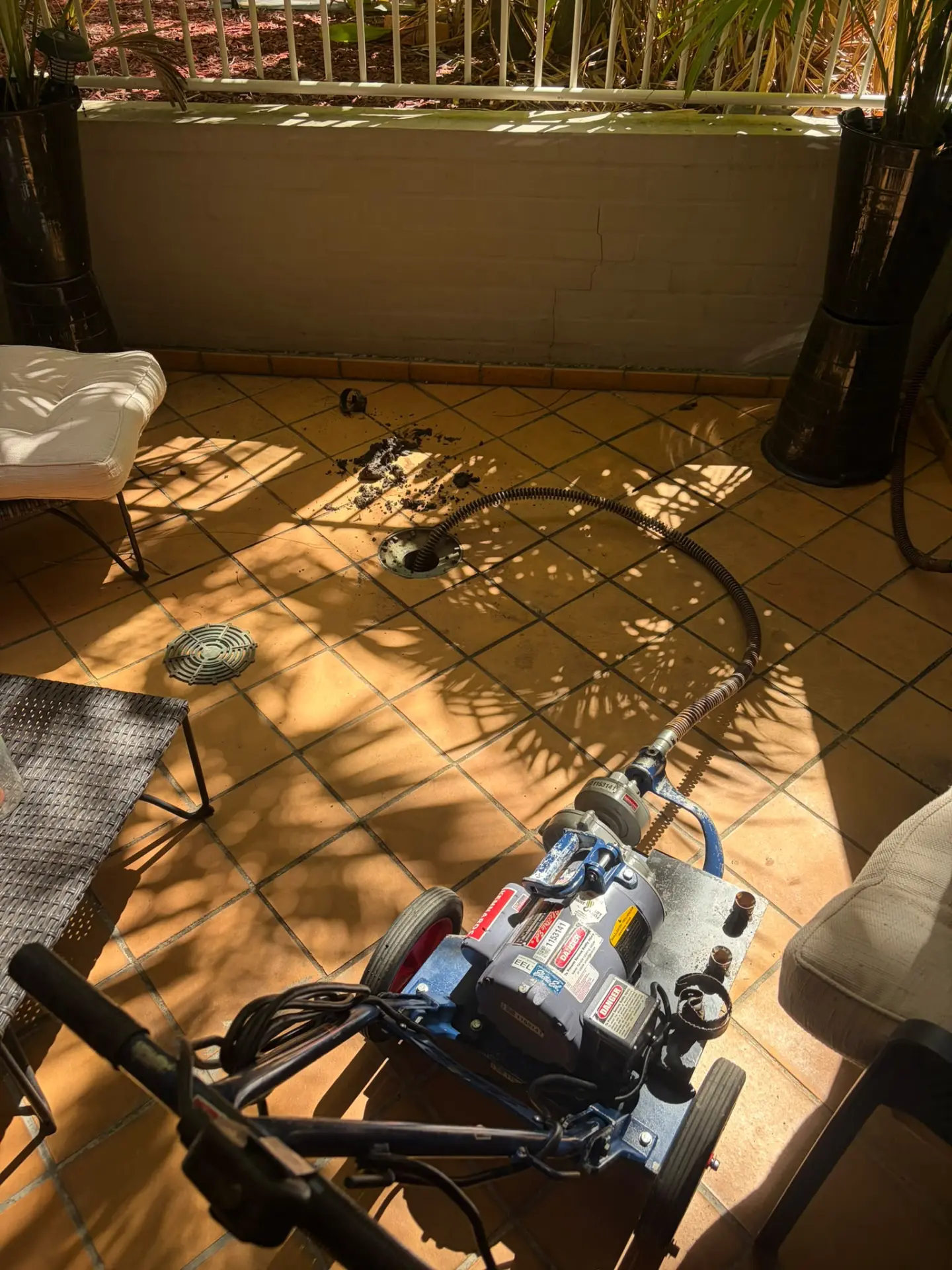 Blocked drain being cleared with an electric eel machine at a Sydney home