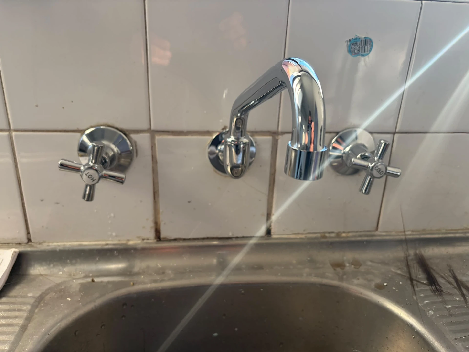 New chrome laundry taps and spout after the repair